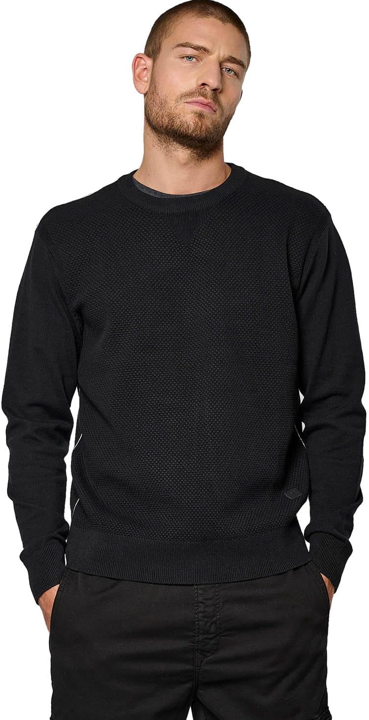 Pavo Monitor Arm installed on a wooden desk with cables organized